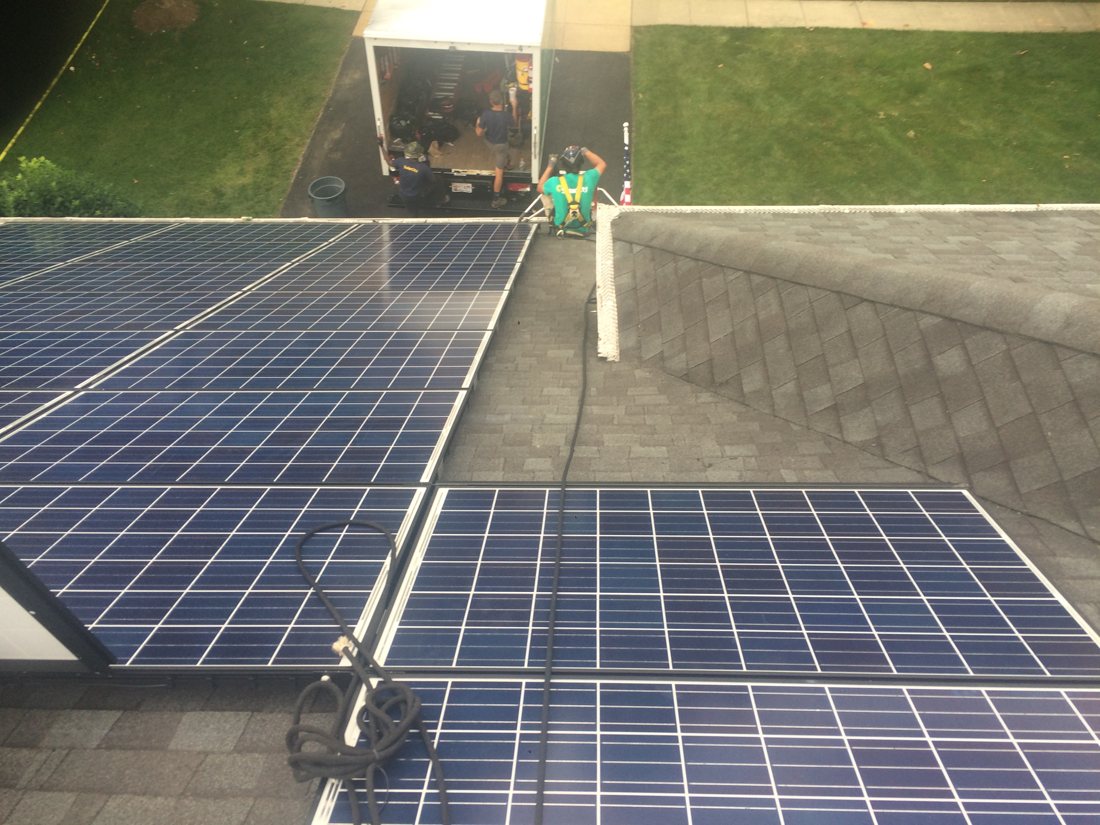 Finished residential solar rows on a shingle rooftop, July 2015
