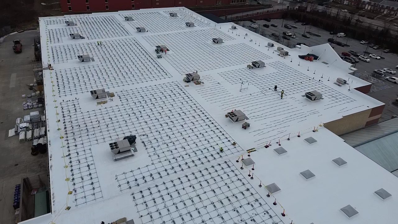 Aerial view of the Towson rooftop with racking fields mid-install, January 2026